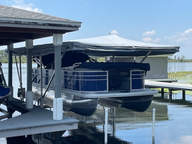 pontoon boat with touchless boat cover