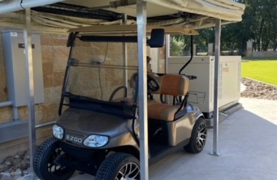 Golf Cart Cover installed on the side of a house