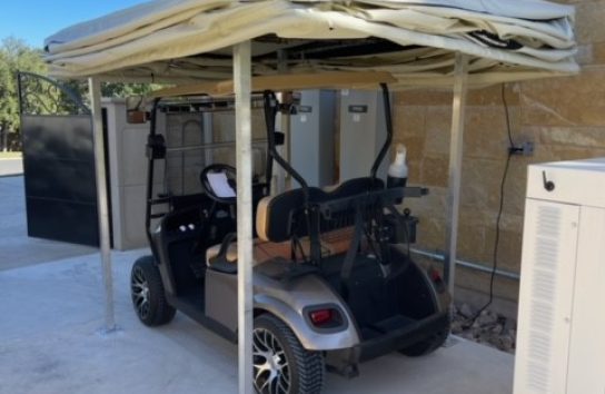 Golf Cart Cover installed on the side of a house