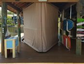 Beautiful Touchless Boat Cover closed on a covered dock.