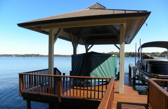 Automatic Boat Cover in a boat house on a Florida Lake