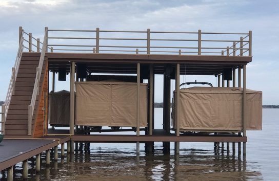 Two Touchless Boat Covers, side by side, lake dock. No snaps or straps, automatic boat cover