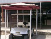 Automatic Golf Cart Cover outside of a house