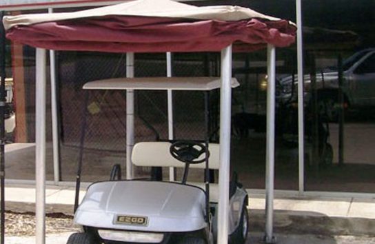 Automatic Golf Cart Cover outside of a house
